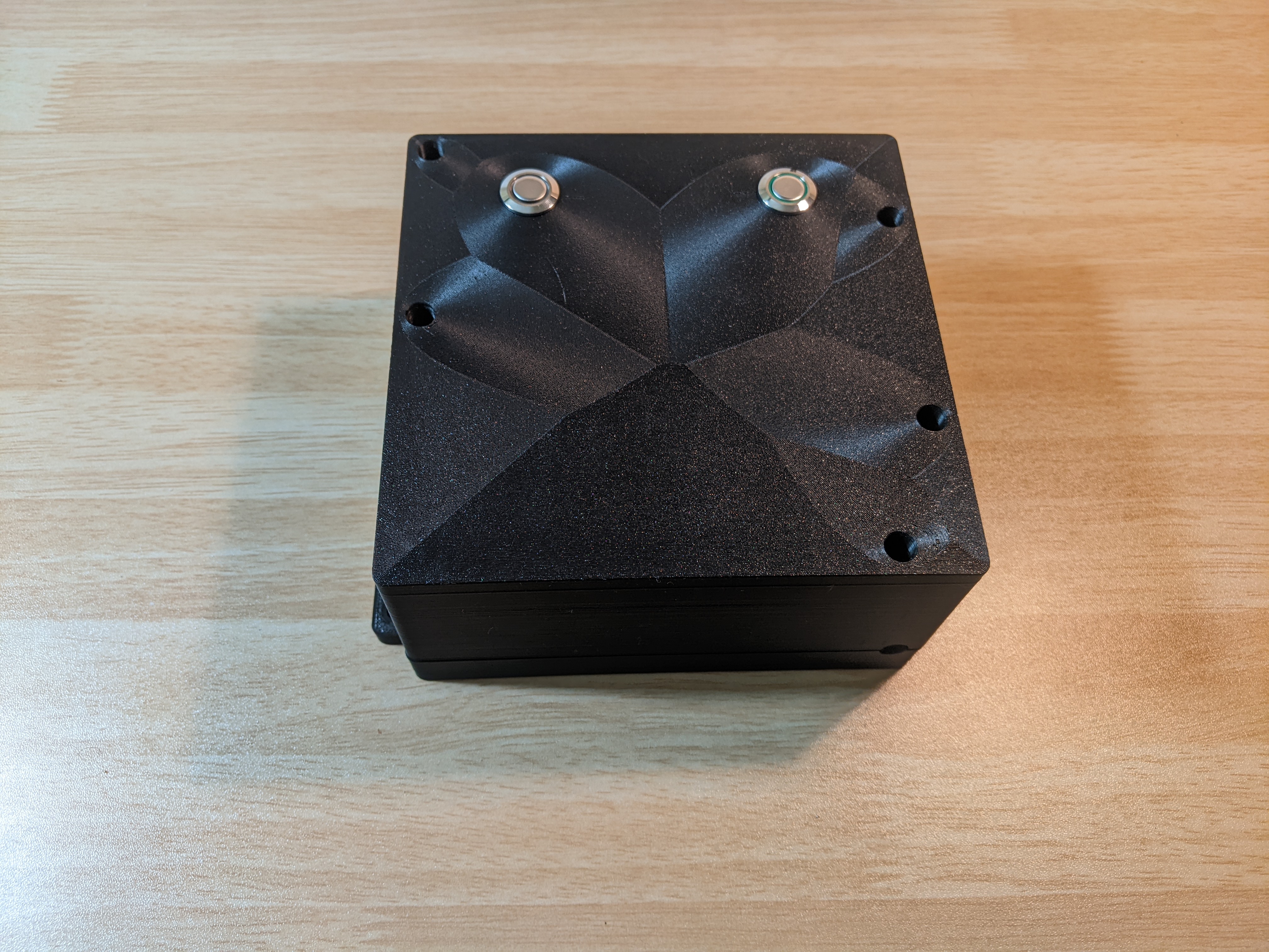 An outside view of the case for the sluice peripheral. It has a two buttons to add time to the timer, and toggle the power.