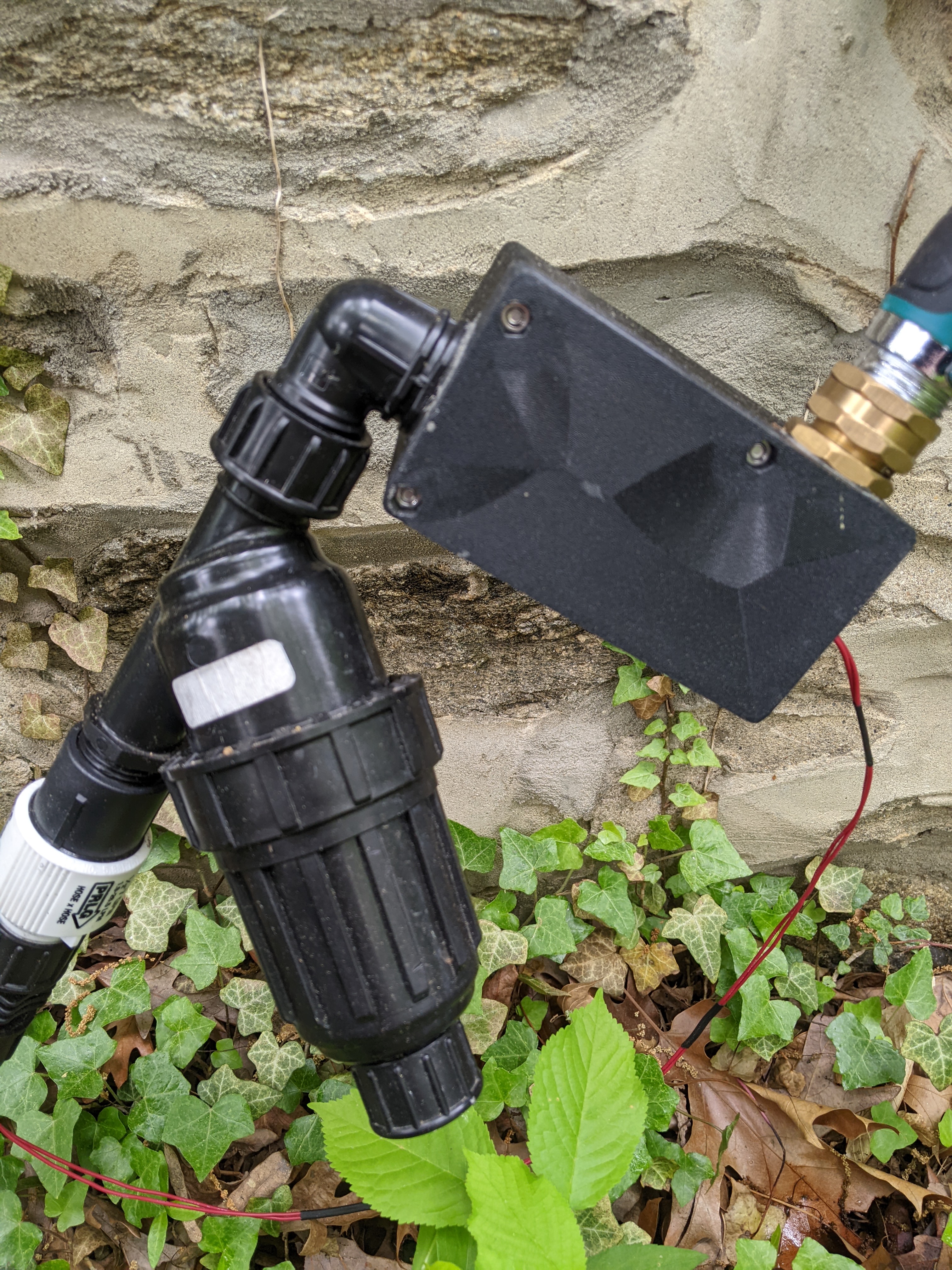 The solenoid that controls the flow of water is installed inline in tubing that comes from a spigot and to a filter.